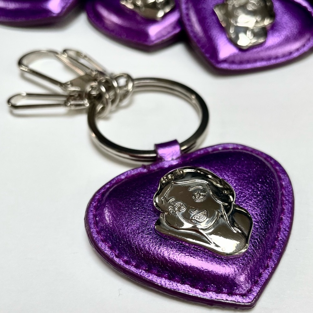Fourteen (14) Disney Snow White Keychains
Purple with Silver Emblem and Hardware